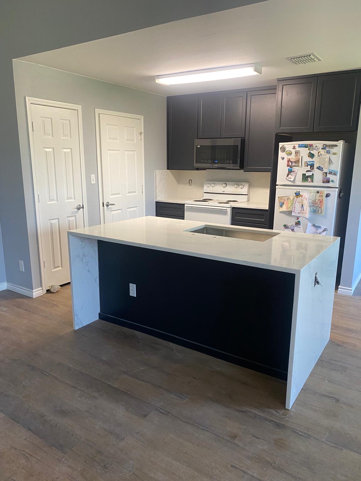 Waterfall island with quartz countertops